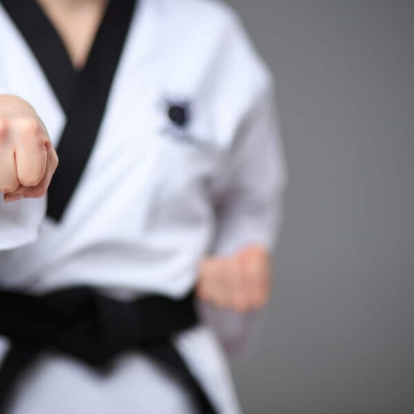 black karate belt tied across someone's waist